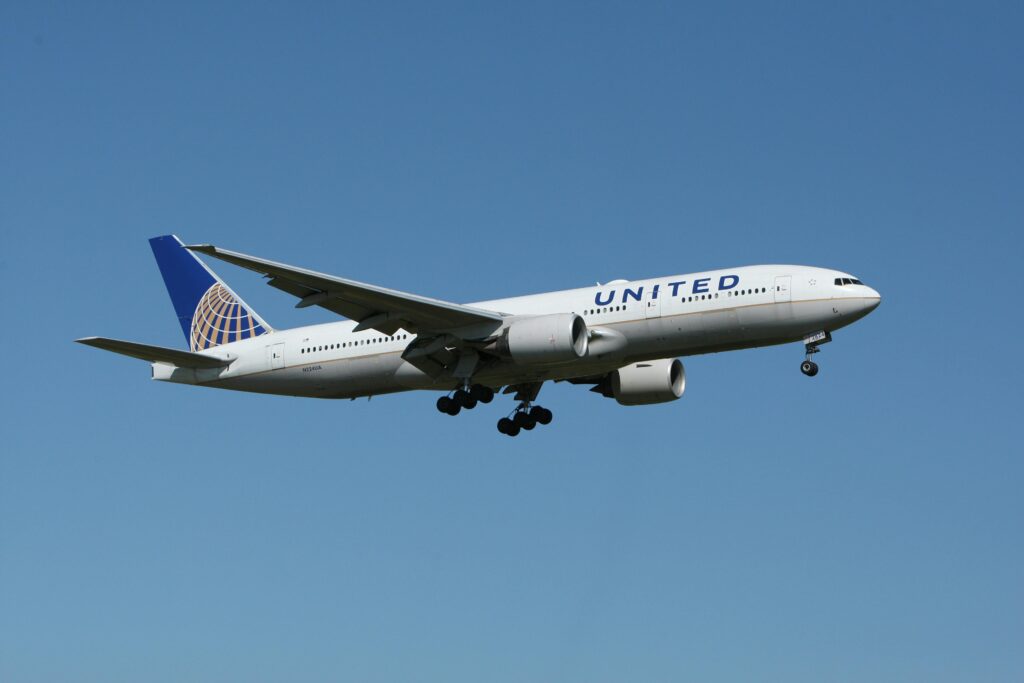 A United airliner flying against a clear blue sky, showcasing air travel.
United Airlines Starlink Wi-Fi